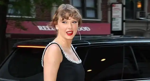 Image from Daily Mail | Taylor Swift News: The secret message stitched into Taylor Swift's $55,000 'coup' outfit ...