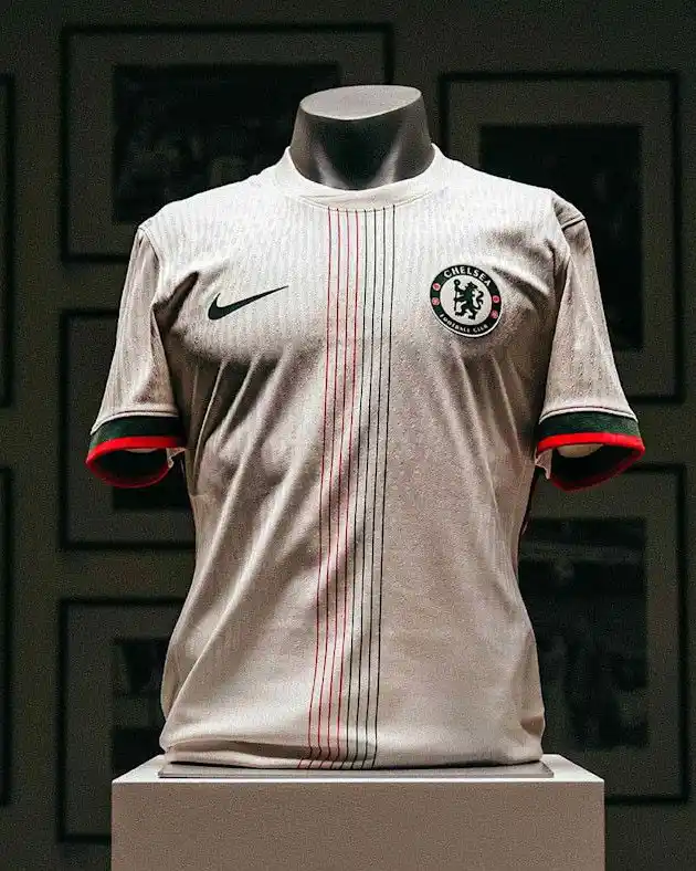 Image from Sportblits: 🗞 Chelsea’s 2025-26 away kit is out! Off-white with red and green pin...