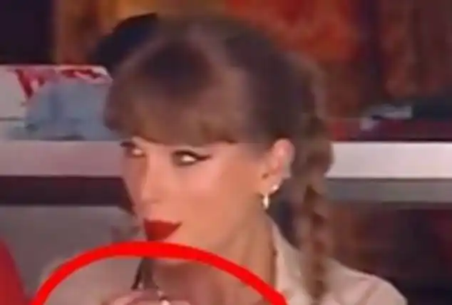 Image from Daily Mail | Taylor Swift News: All the Easter eggs in Taylor Swift's outfit at hockey game after Trav...