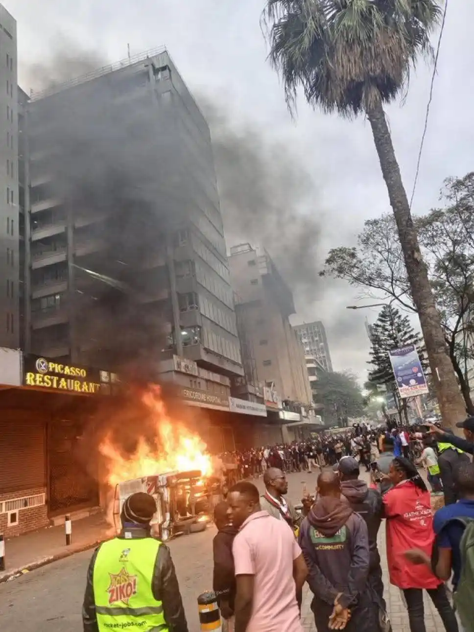 Image from GTN TV: Angry hawkers set ablaze a Nairobi County Inspectorate vehicle near Af...