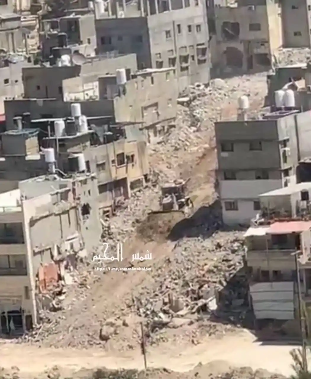 Image from Quds News Network: Israeli army bulldozers continue their systematic destruction of homes...
