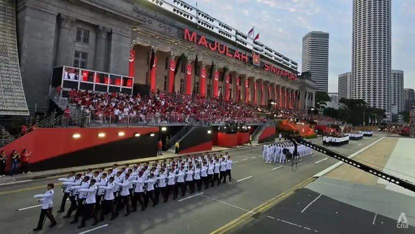Image from CNA: A 47-year-old man has died after collapsing during a National Day Para...