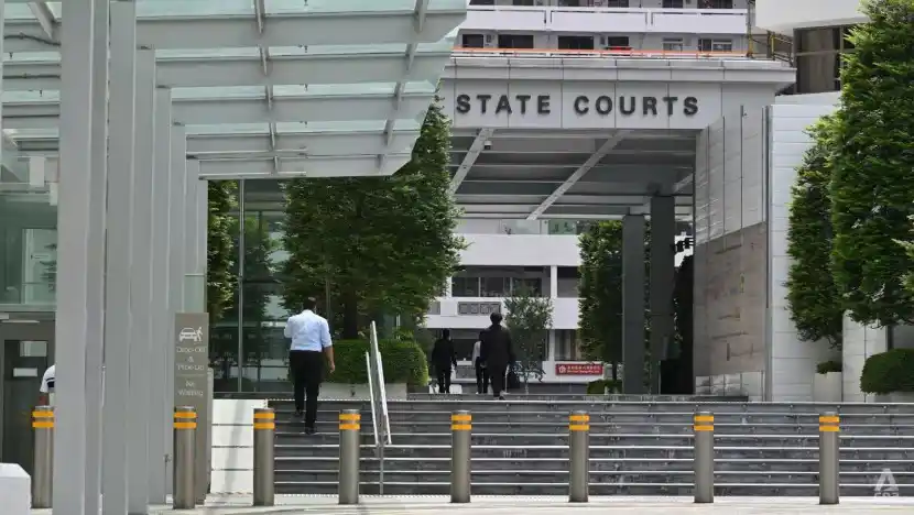 Image from CNA: A former teacher will be jailed for putting his hand under a 7-year-ol...