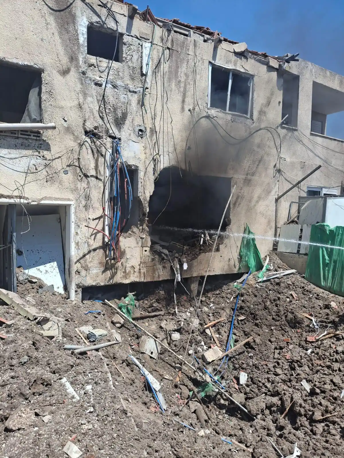 Image from StandWithUs: Site of the direct impact in northern Israel from an attack drone fire...