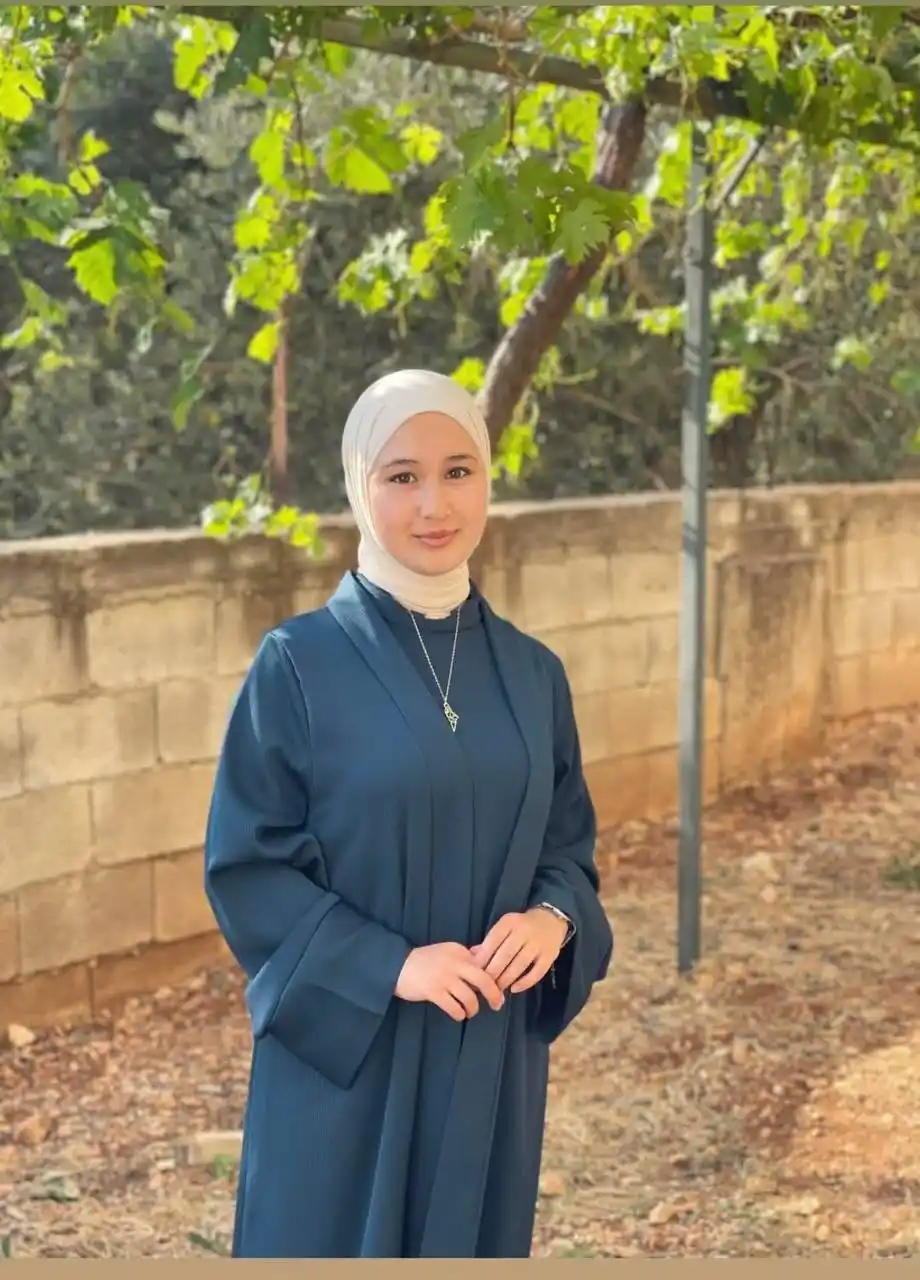 Image from Quds News Network: Salam Rezqallah, a young Palestinian woman, was detained last night by...